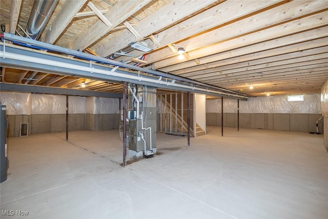 24326 Mastick Rd, North Olmsted, OH 44070 - unfinished basement with stairs, heating unit, and water heater