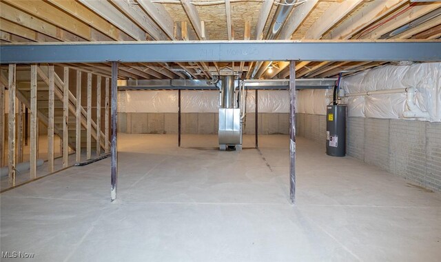 24326 Mastick Rd, North Olmsted, OH 44070 - unfinished below grade area with electric water heater and heating unit