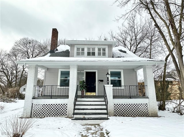 bungalow-style home with a porch