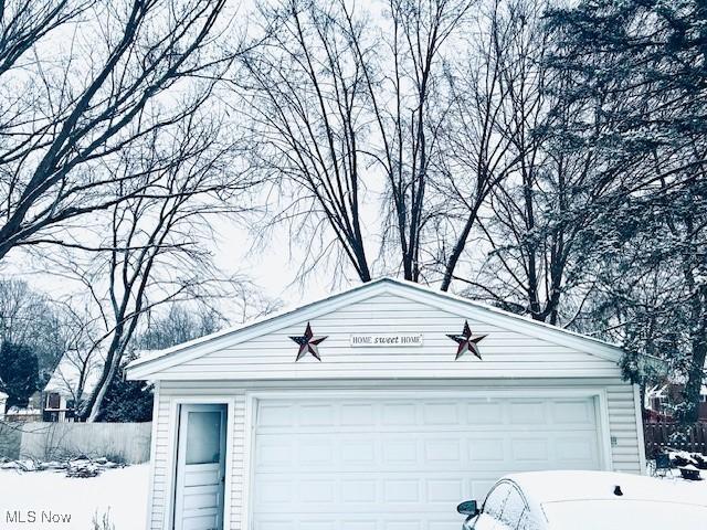 view of snow covered garage