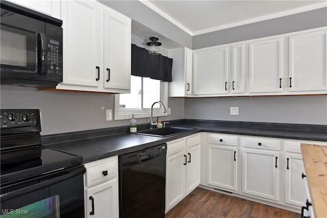 kitchen featuring sink, crown molding, black appliances, dark hardwood / wood-style flooring, and white cabinets