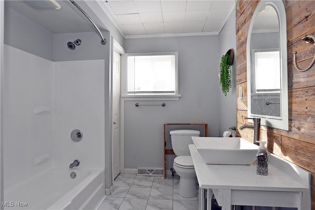 full bathroom featuring sink, plenty of natural light, bathtub / shower combination, and toilet