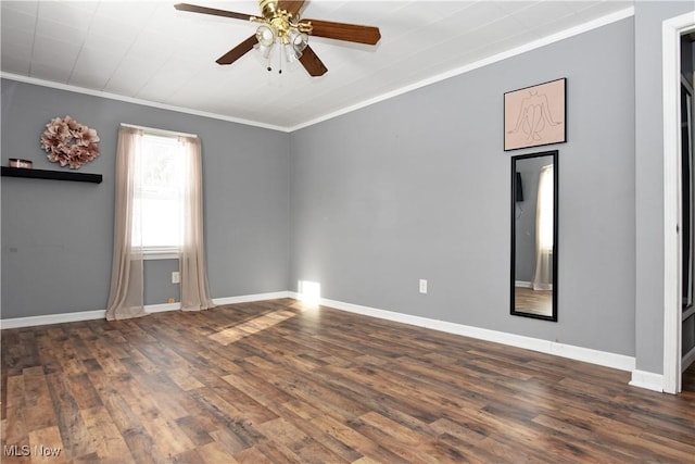 empty room featuring ornamental molding, dark hardwood / wood-style floors, and ceiling fan