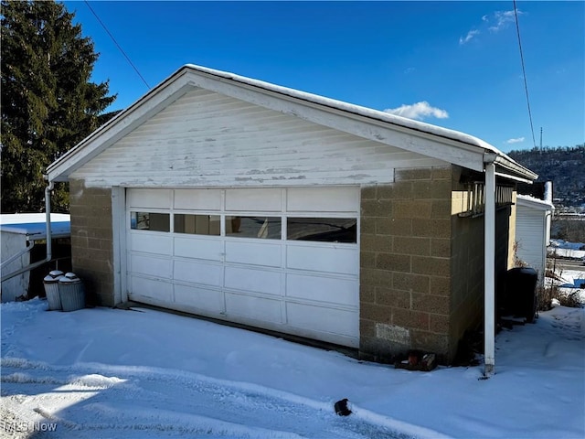 view of snow covered garage