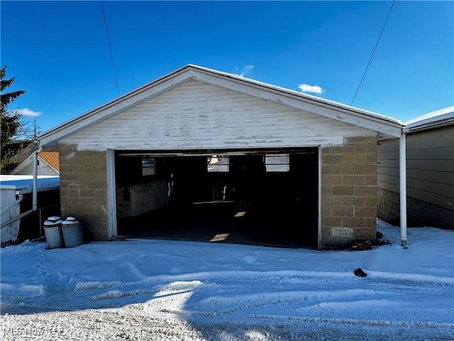 view of snow covered garage