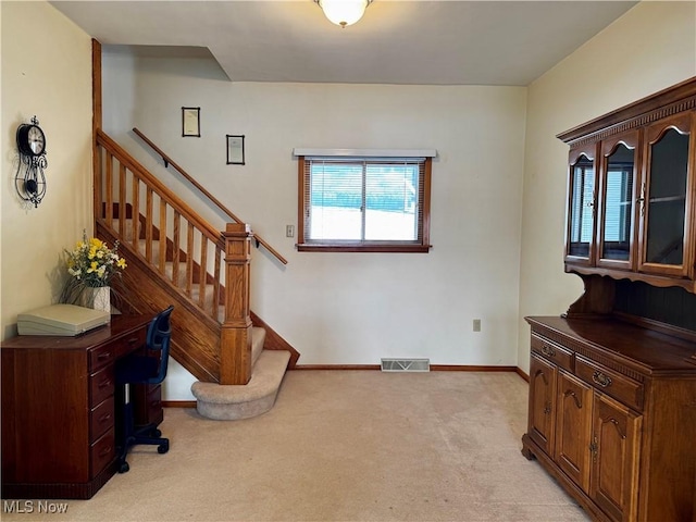 view of carpeted entrance foyer