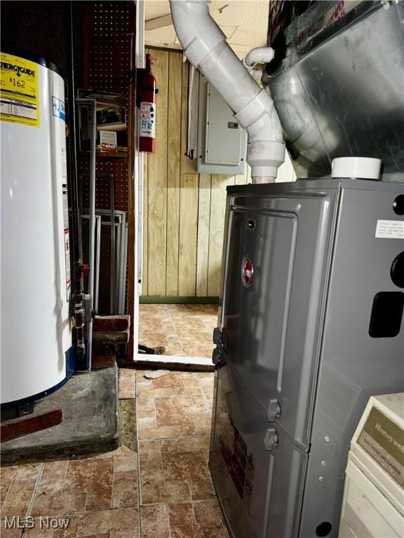 utility room with water heater and electric panel