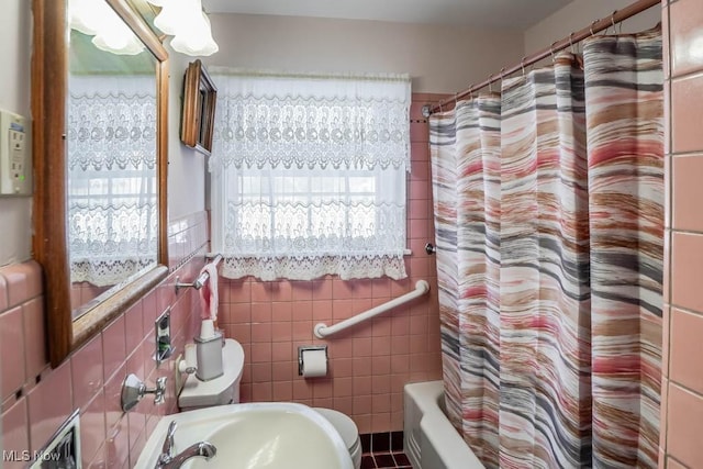 bathroom featuring tile walls, sink, tile patterned flooring, and shower / tub combo with curtain