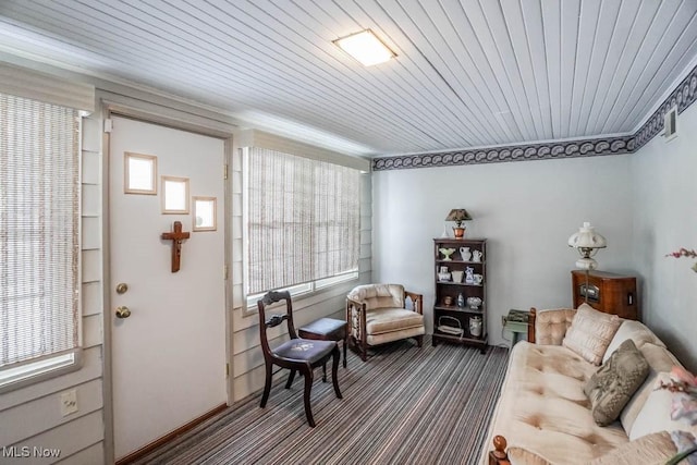 sitting room featuring a healthy amount of sunlight and wooden ceiling