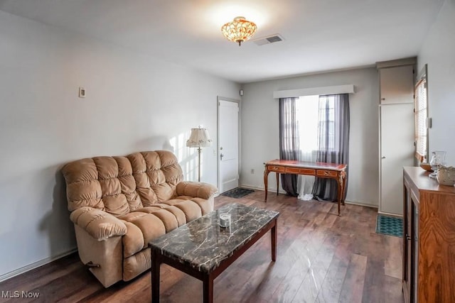 living room featuring dark wood-type flooring