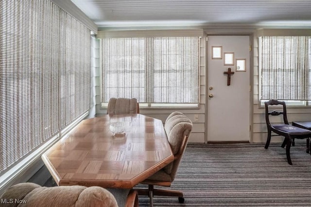 dining area featuring crown molding