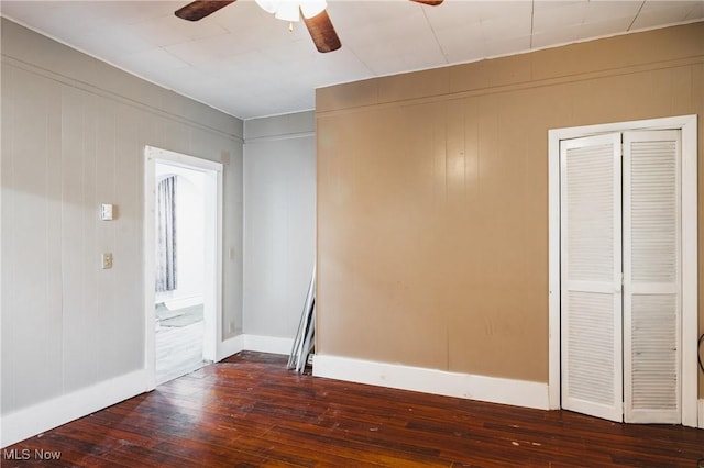 empty room featuring dark hardwood / wood-style floors and ceiling fan