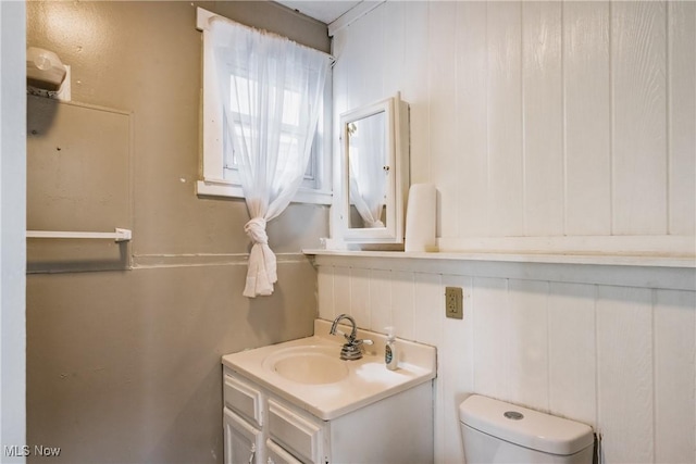 bathroom with vanity and toilet