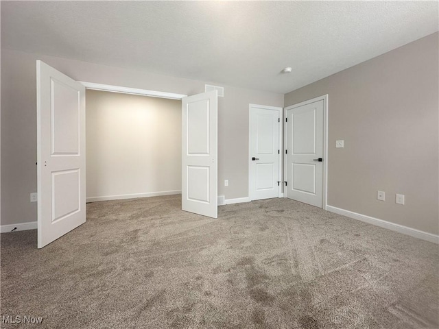 unfurnished bedroom featuring carpet flooring