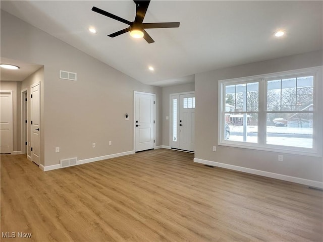 unfurnished living room with vaulted ceiling, ceiling fan, and light hardwood / wood-style floors