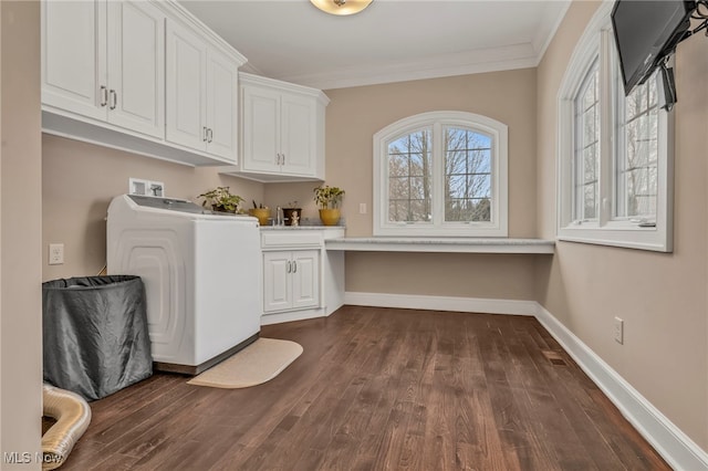 clothes washing area with crown molding, cabinets, washer / clothes dryer, and dark wood-type flooring