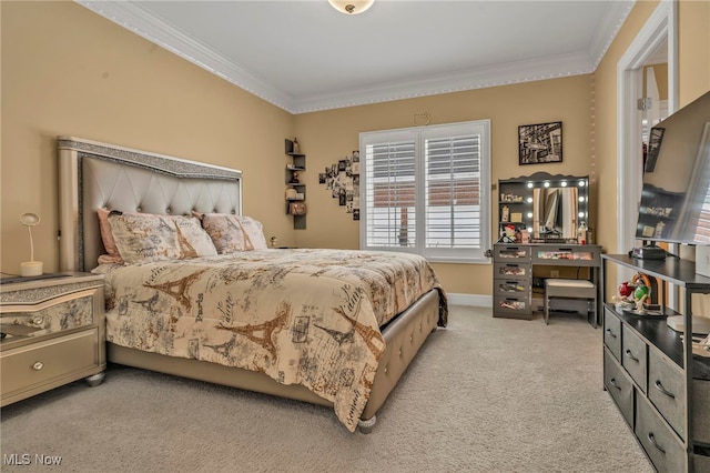 bedroom with ornamental molding and light carpet