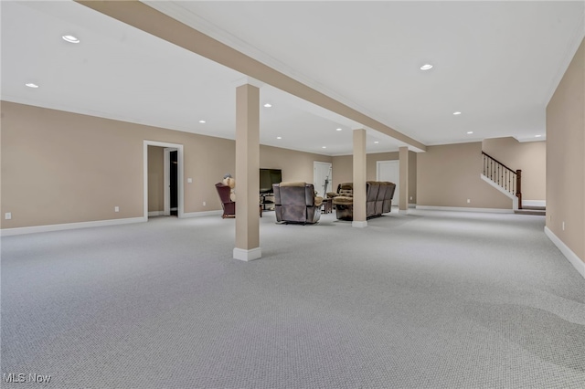 basement featuring ornamental molding and light carpet