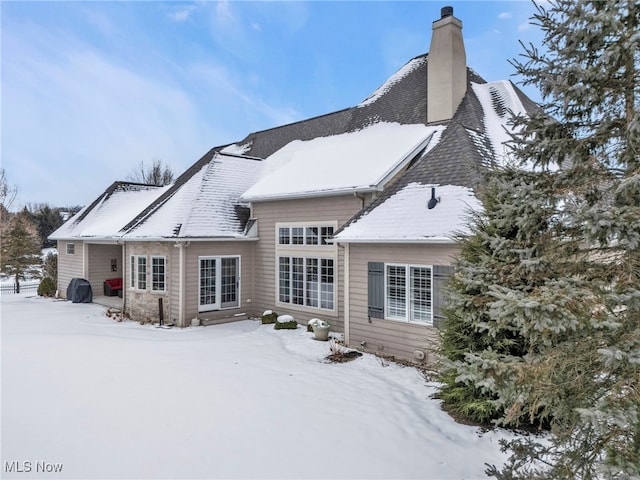 view of snow covered house