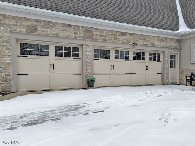 view of snow covered garage