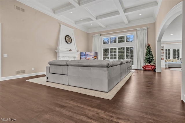 living room featuring coffered ceiling, beam ceiling, dark wood-type flooring, and ornamental molding