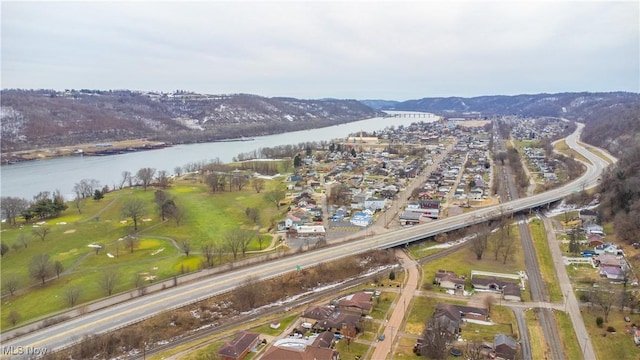 drone / aerial view with a water and mountain view