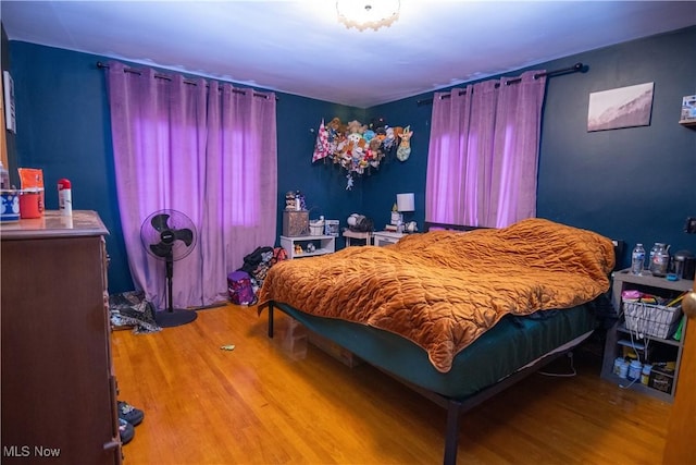 bedroom with hardwood / wood-style floors