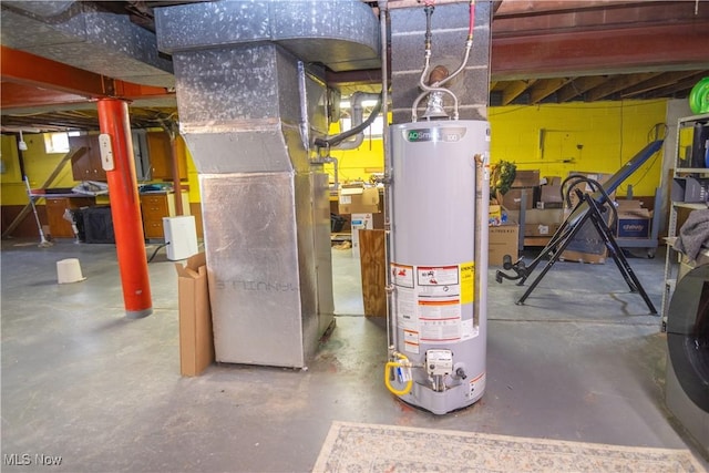 utility room featuring heating unit and gas water heater