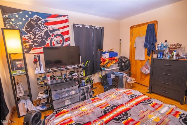 bedroom with light wood-type flooring