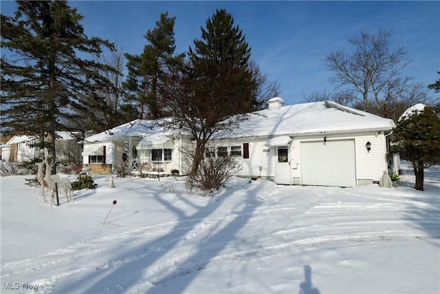 single story home featuring a garage