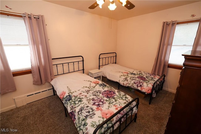 carpeted bedroom featuring ceiling fan and a baseboard radiator