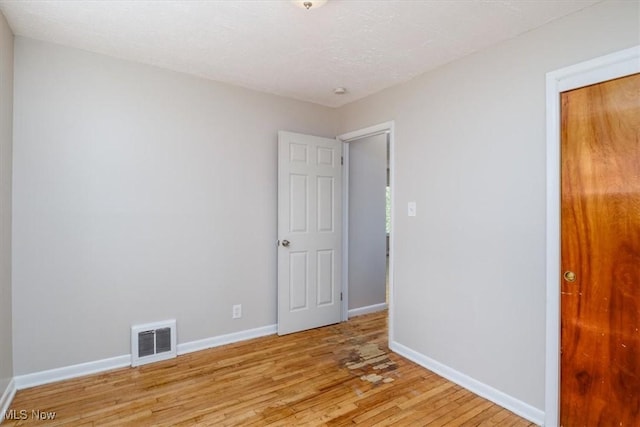 empty room featuring light hardwood / wood-style floors