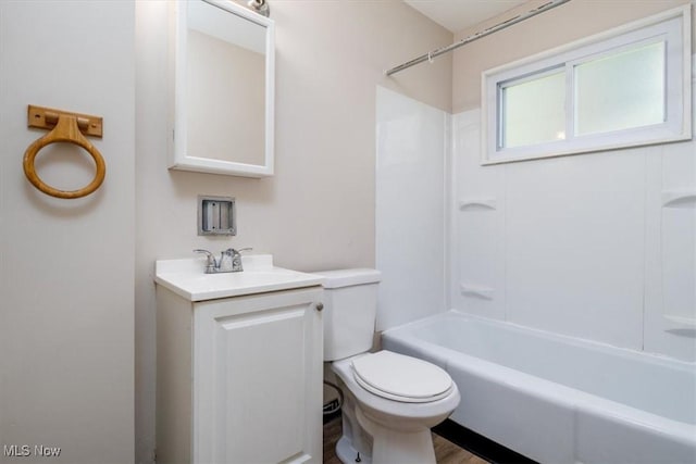 full bathroom featuring vanity, toilet, and tub / shower combination