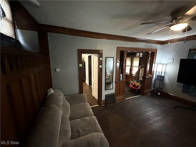 living room with a wealth of natural light and ceiling fan