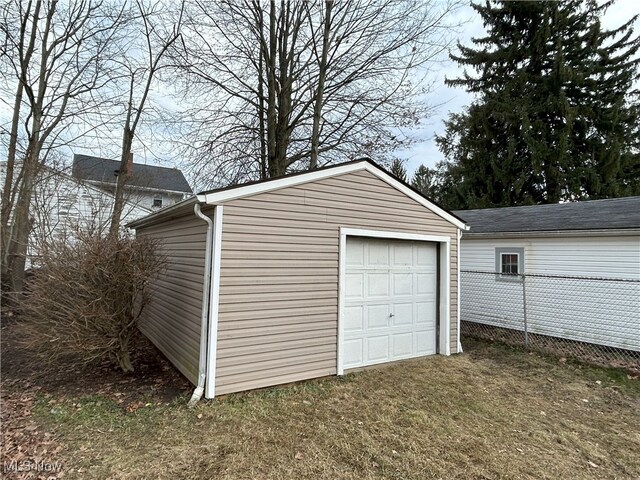 garage featuring a lawn