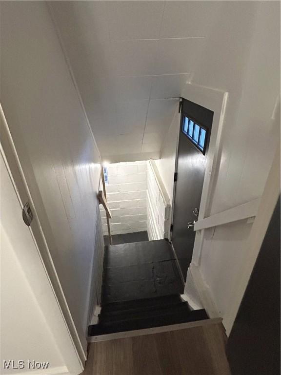 staircase featuring hardwood / wood-style floors