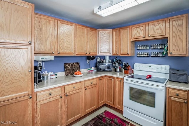 kitchen featuring white electric stove