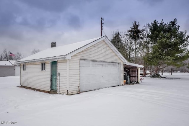 view of snow covered garage