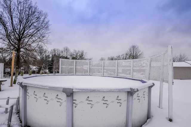 view of snow covered pool