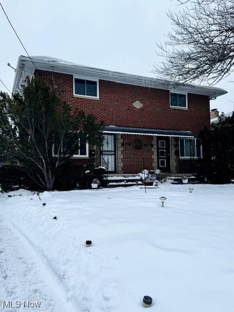 view of snow covered house