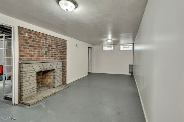 basement with a brick fireplace