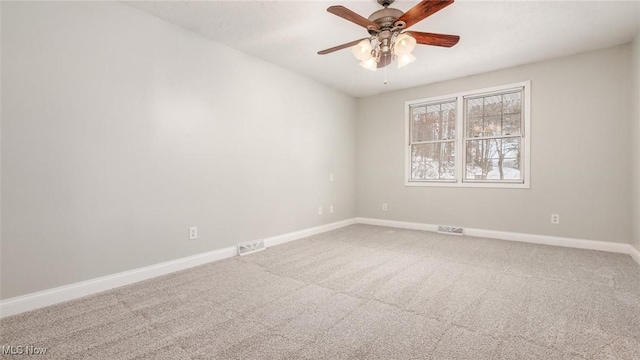 carpeted empty room with ceiling fan