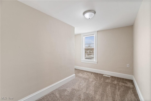 empty room featuring carpet floors