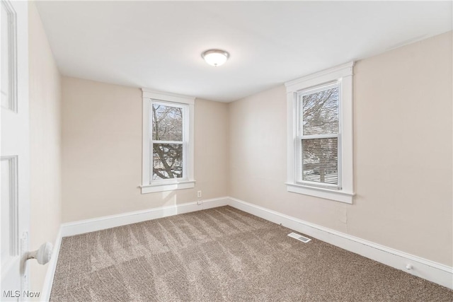 750 Florida Ave, Akron, OH 44314 - carpeted empty room featuring baseboards and visible vents