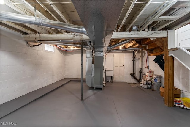 basement featuring heating unit