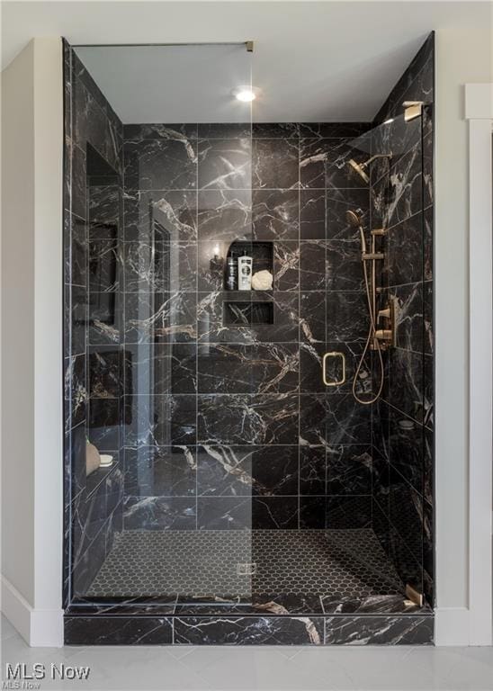 bathroom with a shower with shower door