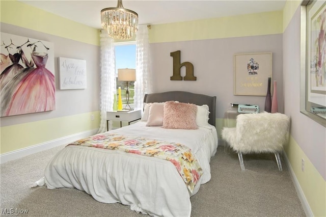 carpeted bedroom featuring a notable chandelier