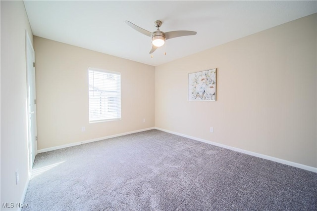 empty room featuring ceiling fan and carpet flooring