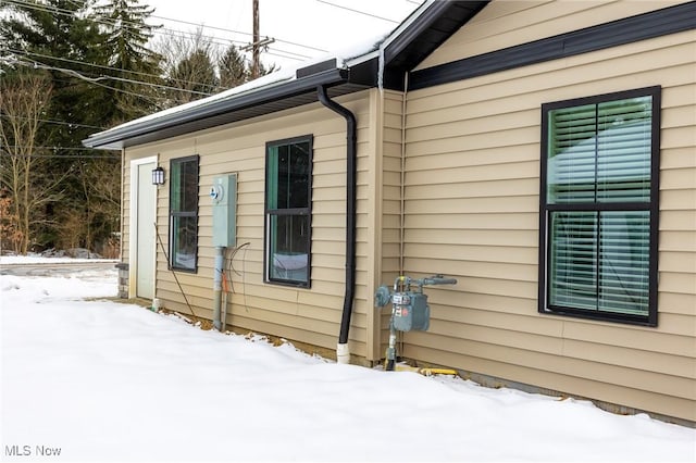 view of snow covered property