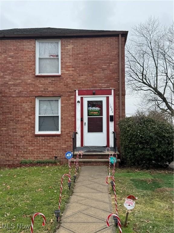 exterior space with a front lawn